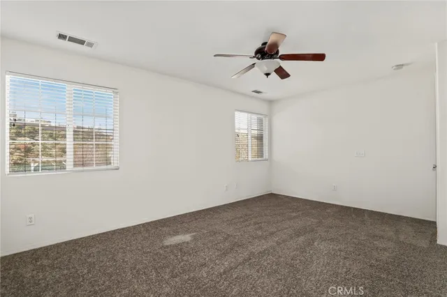 a spacious bathroom with a tub sink and mirror