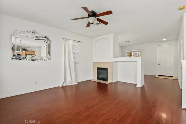 a large kitchen with granite countertop a stove sink and cabinets
