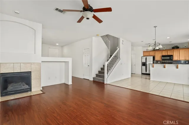 a kitchen with stainless steel appliances granite countertop a stove a refrigerator and a microwave