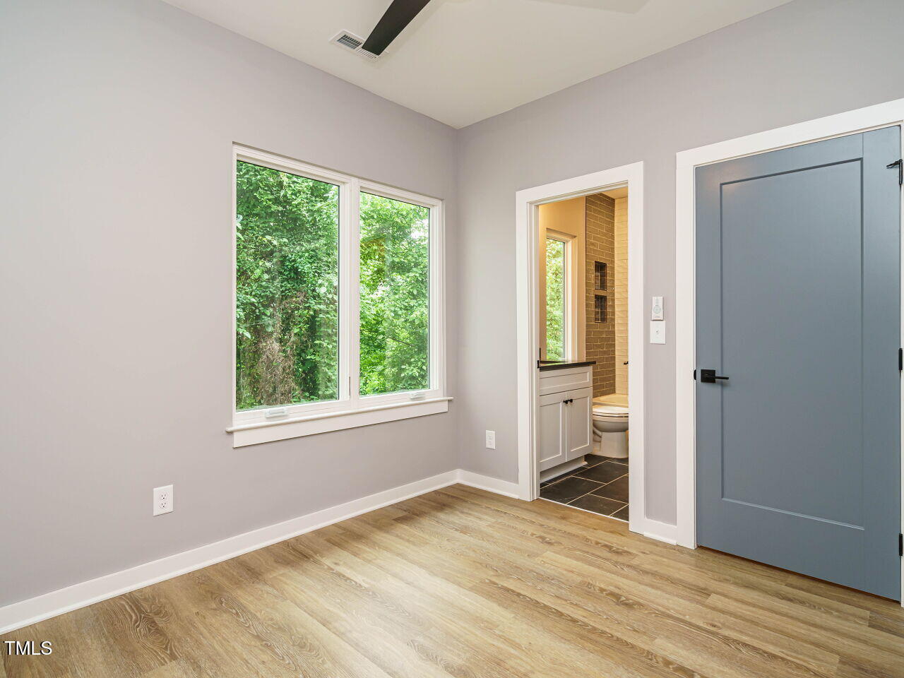 1525 Havenmont Court Raleigh, NC 27608 - Photo 19 of 40 an empty room with windows and closet