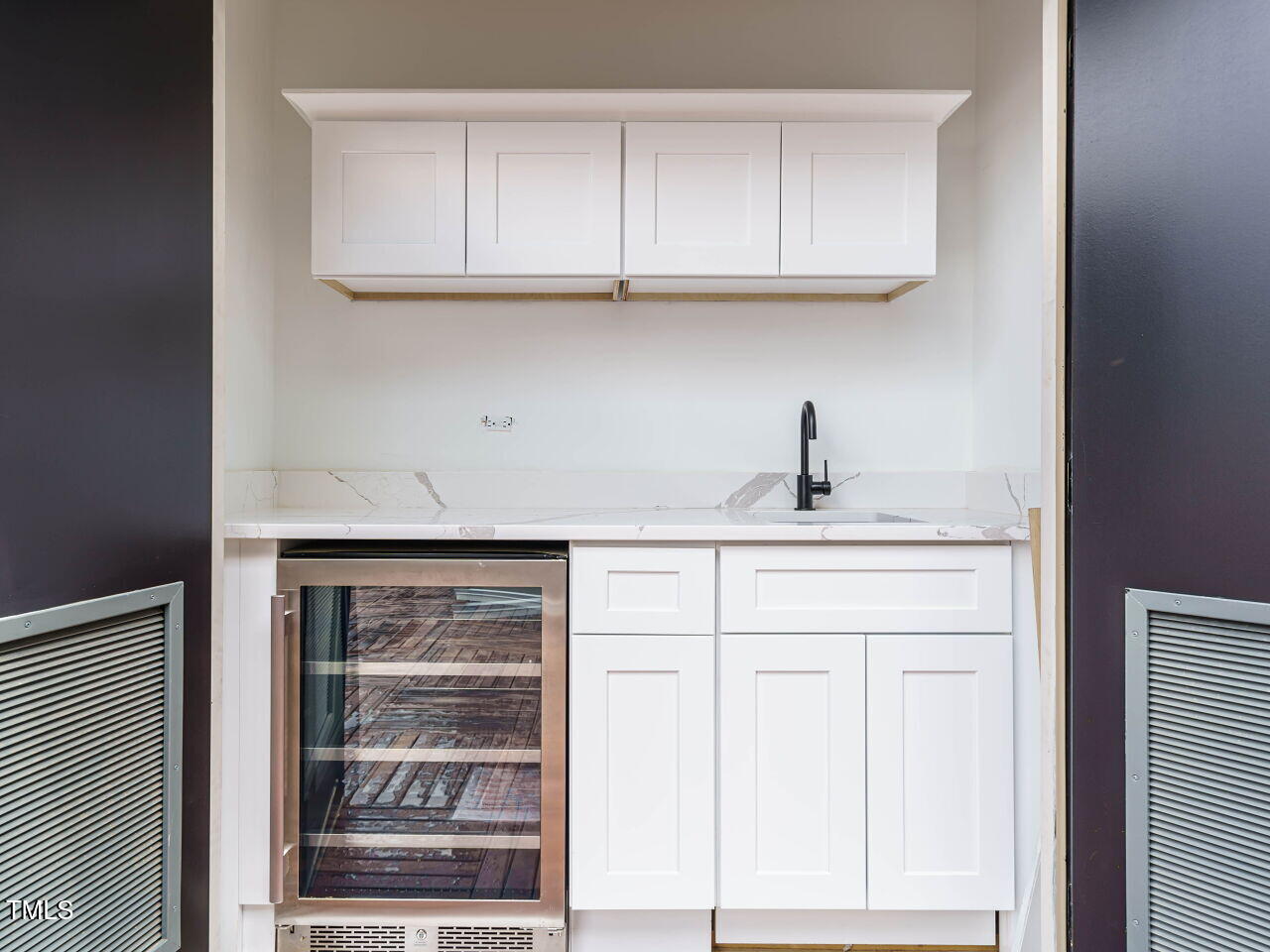 1525 Havenmont Court Raleigh, NC 27608 - Photo 22 of 40 a kitchen with granite countertop white cabinets and a sink