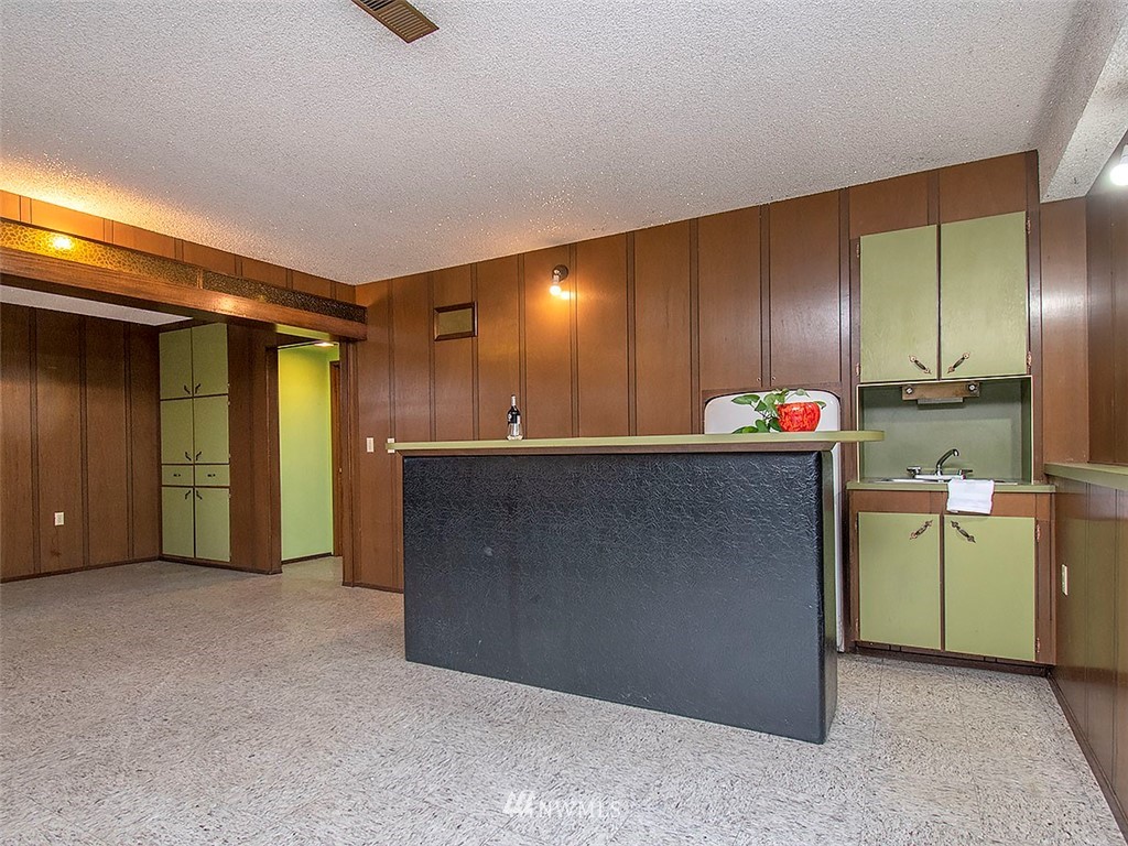 17371 Southeast 133rd Street Renton, WA 98059 - Photo 17 of 22 a kitchen with refrigerator and cabinets