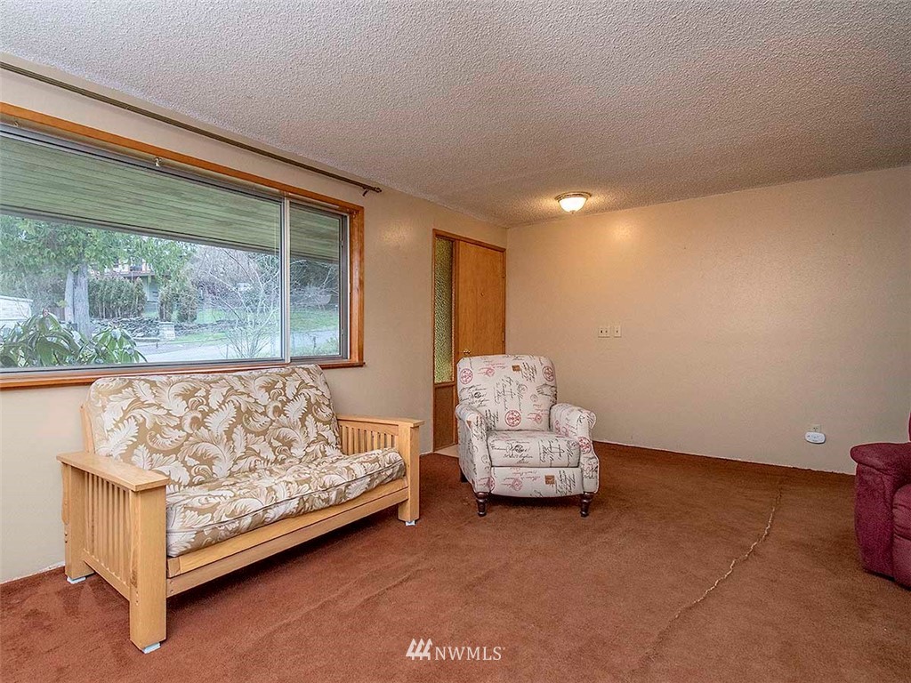 17371 Southeast 133rd Street Renton, WA 98059 - Photo 3 of 22 a bedroom with a bed and a window