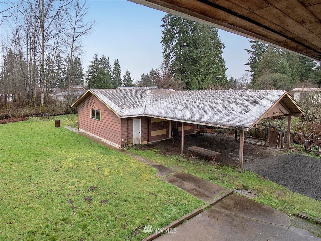 17371 Southeast 133rd Street Renton, WA 98059 - Photo 22 of 22 a backyard of a house with table and chairs