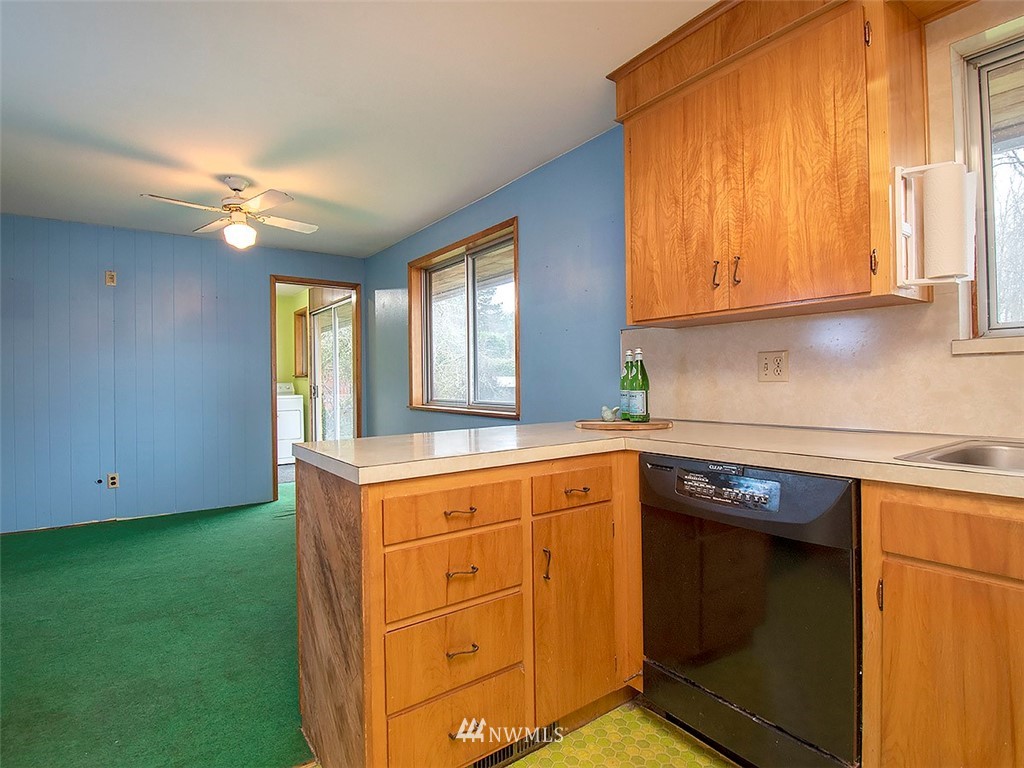 17371 Southeast 133rd Street Renton, WA 98059 - Photo 6 of 22 a kitchen with cabinets appliances and a window