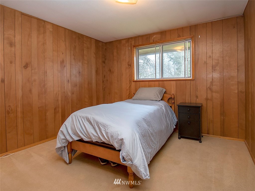 17371 Southeast 133rd Street Renton, WA 98059 - Photo 10 of 22 a bed sitting in a bedroom next to a window