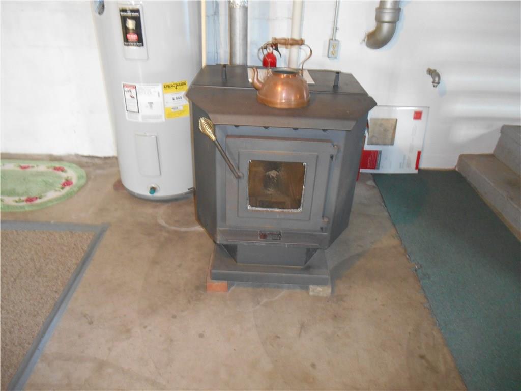 199 Fitz Henry Road Smithton, PA 15479 - Photo 17 of 18 Pellet stove in basement