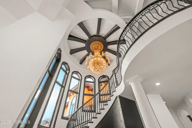 a kitchen with kitchen island granite countertop a stove oven and a refrigerator