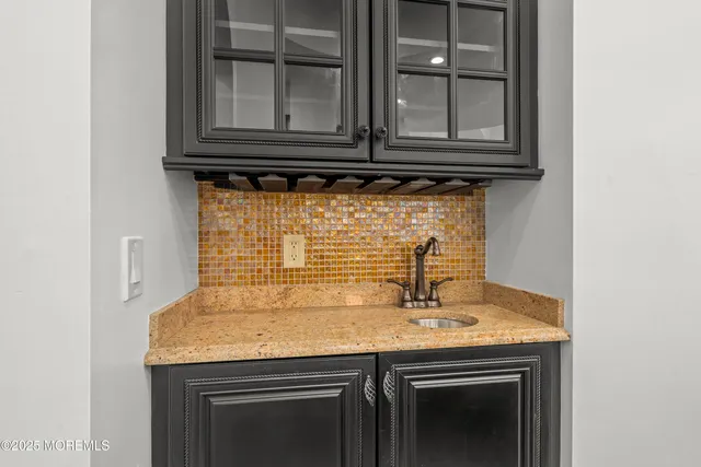 a kitchen with stainless steel appliances granite countertop a stove and a sink