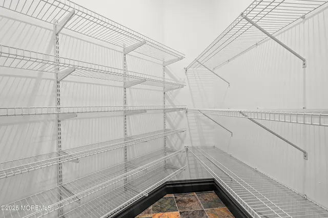 a bed room with a bed and a television