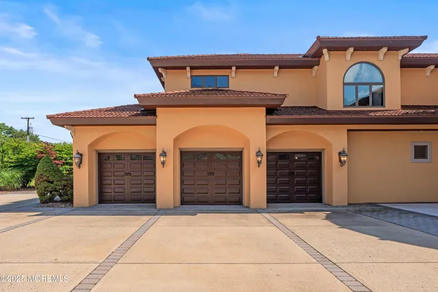 a kitchen with granite countertop cabinets stove top oven and microwave