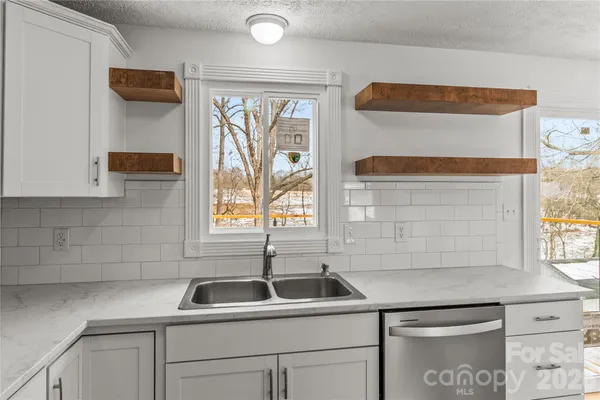 a kitchen with a sink and a window