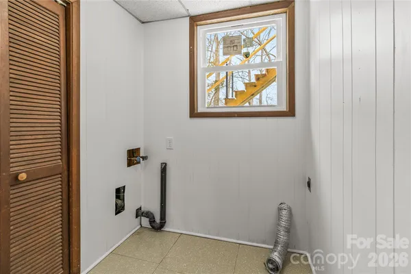 a bathroom with a painting on the wall