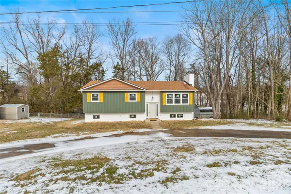 a view of a yard in front of a house