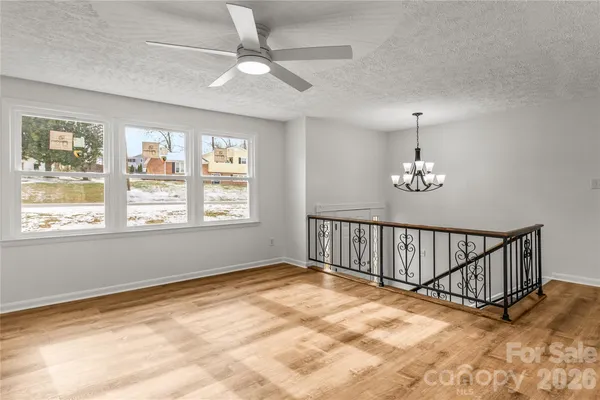 a view of an empty room with windows