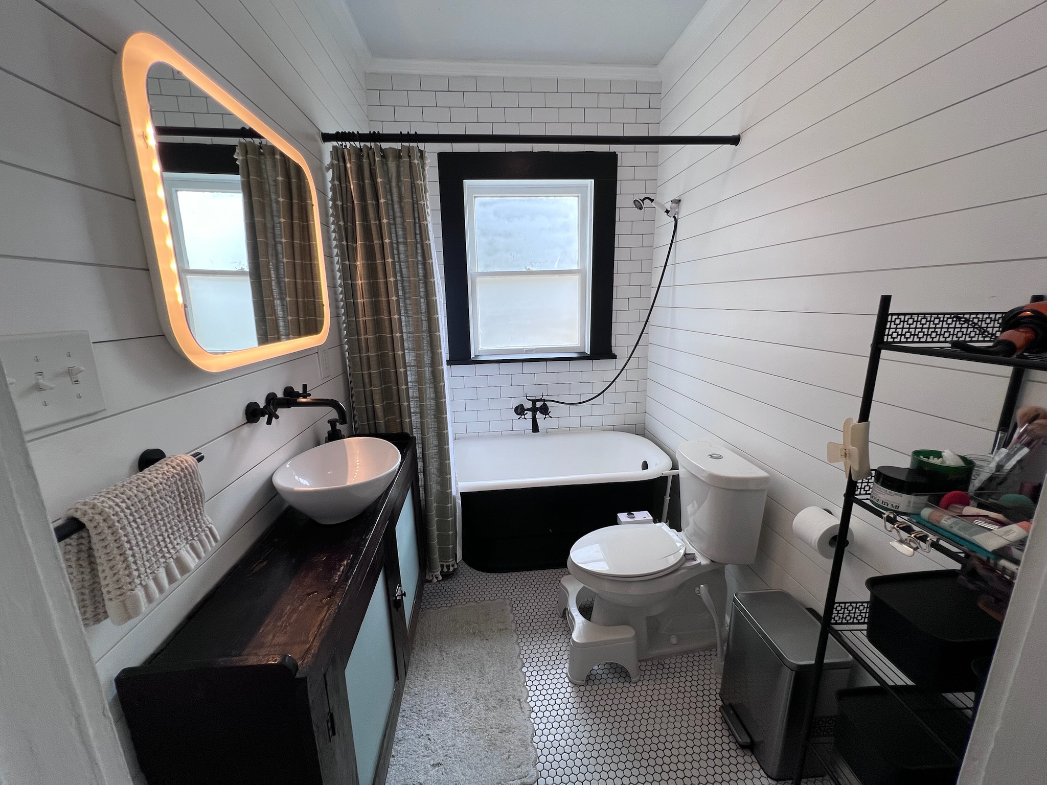 307 East 35th Street, Unit A Austin, TX 78705 - Photo 20 of 31 A well-appointed bathroom showcasing a vessel sink and a classic clawfoot tub, ideal for unwinding.