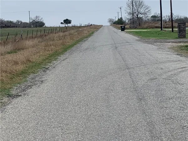 a view of a lake and a yard