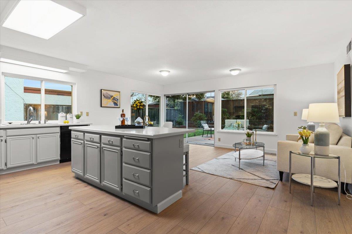 7206 Vía Lomas San Jose, CA 95139 - Photo 12 of 37 a kitchen with a sink stove and wooden cabinets