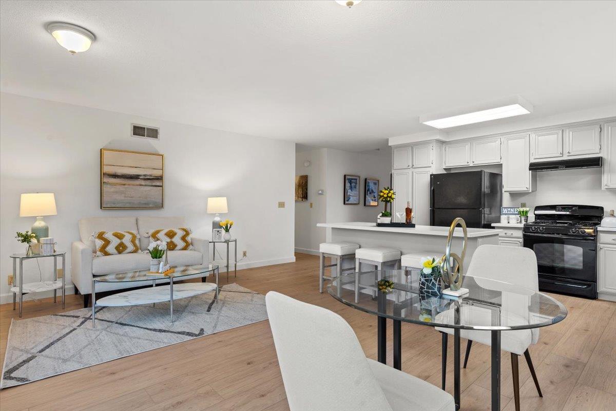 7206 Vía Lomas San Jose, CA 95139 - Photo 15 of 37 a living room with furniture and a dining area with kitchen view