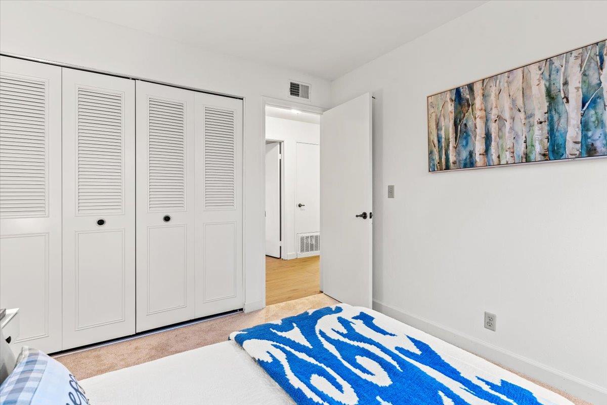 7206 Vía Lomas San Jose, CA 95139 - Photo 20 of 37 a bedroom with a bed and wooden floor