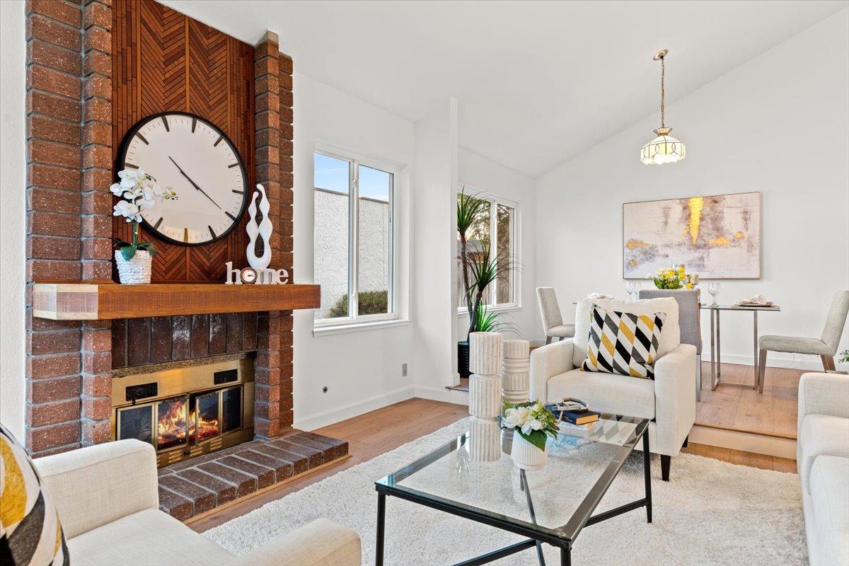 7206 Vía Lomas San Jose, CA 95139 - Photo 4 of 37 a living room with furniture a fireplace and a chandelier