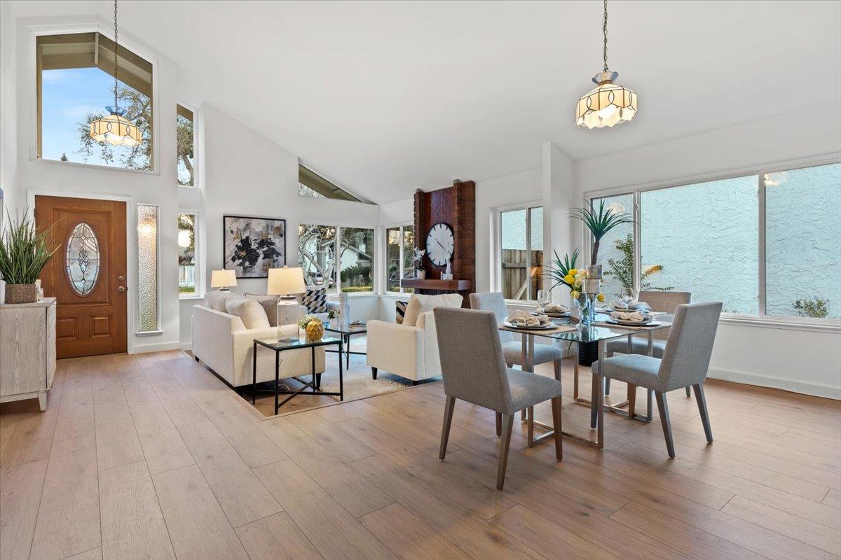 7206 Vía Lomas San Jose, CA 95139 - Photo 6 of 37 a dining room with furniture a chandelier and wooden floor
