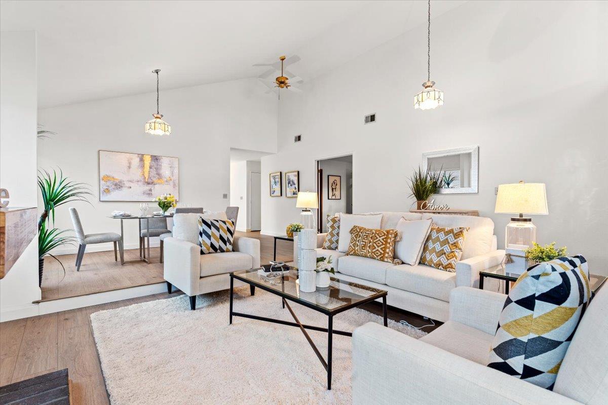 7206 Vía Lomas San Jose, CA 95139 - Photo 7 of 37 a living room with furniture and a chandelier