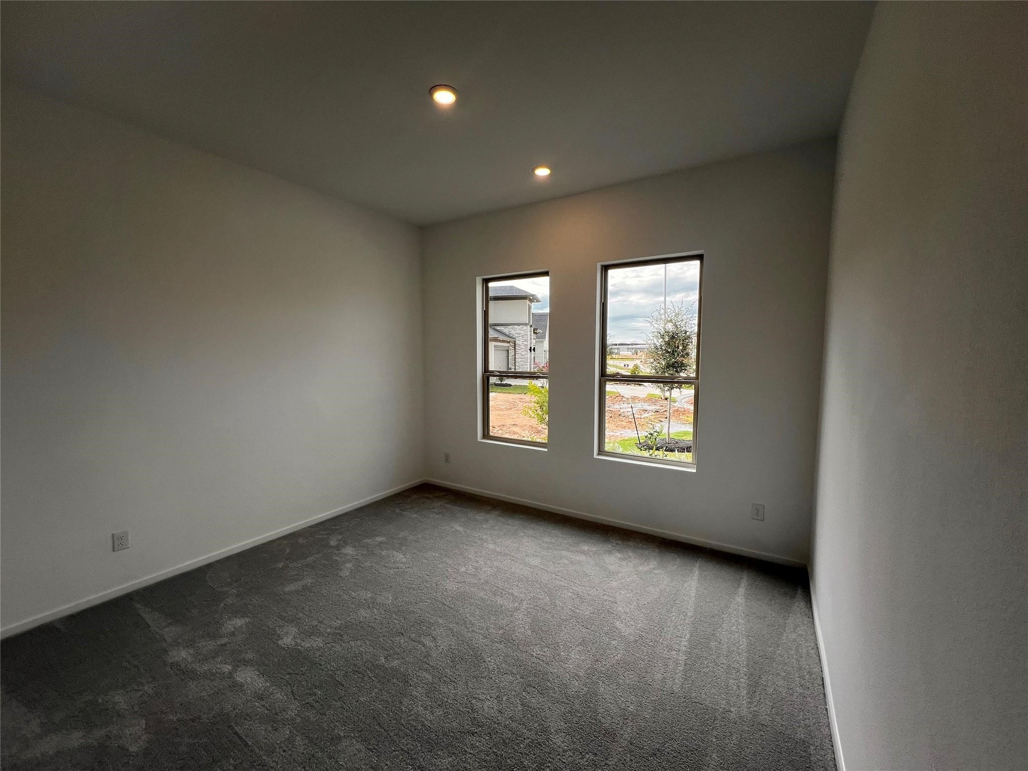 8303 Holly Blue Drive Rosharon, TX 77583 - Photo 15 of 34 an empty room with windows