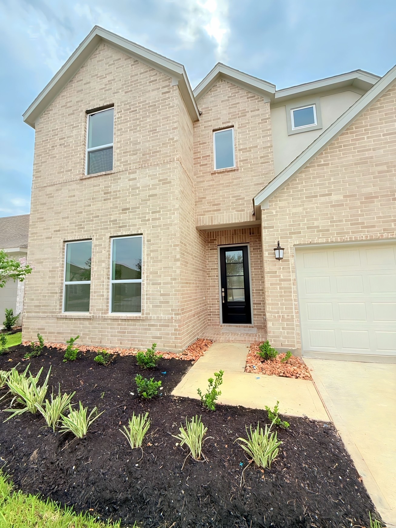 8303 Holly Blue Drive Rosharon, TX 77583 - Photo 2 of 34 a front view of a house with a yard