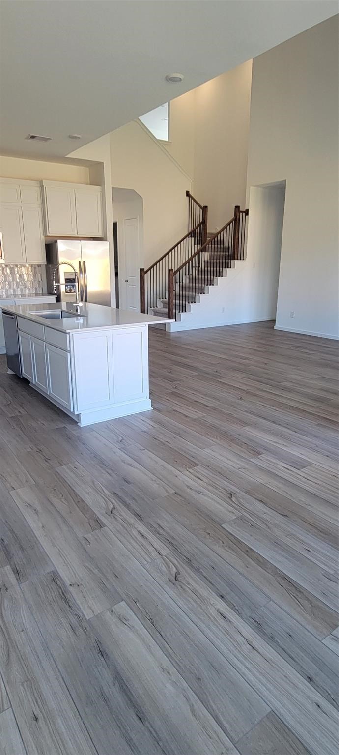 8303 Holly Blue Drive Rosharon, TX 77583 - Photo 6 of 34 a view wooden floor and kitchen view
