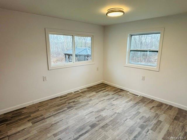 280 Hall Hill Road Ancram, NY 12502 - Photo 11 of 19 a view of an empty room and window