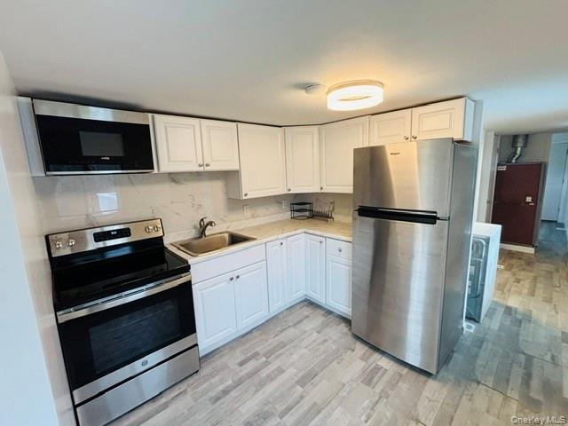 280 Hall Hill Road Ancram, NY 12502 - Photo 13 of 19 a kitchen with a refrigerator stove and microwave