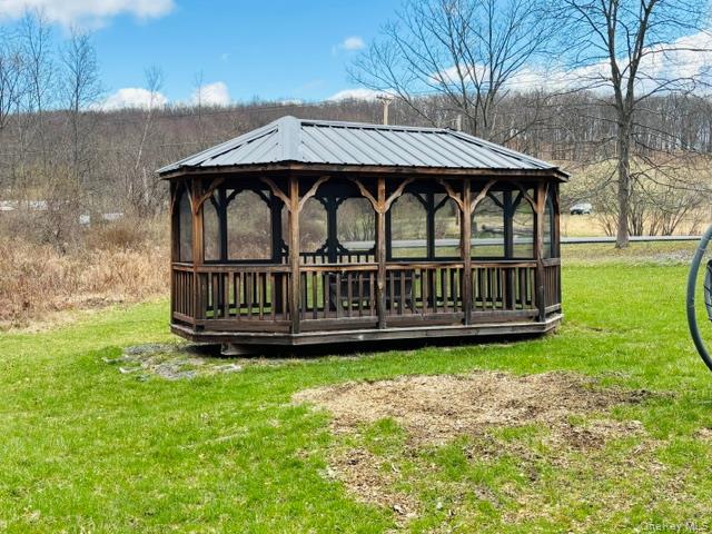 280 Hall Hill Road Ancram, NY 12502 - Photo 6 of 19 a view of a chair and table with fire pit in the park