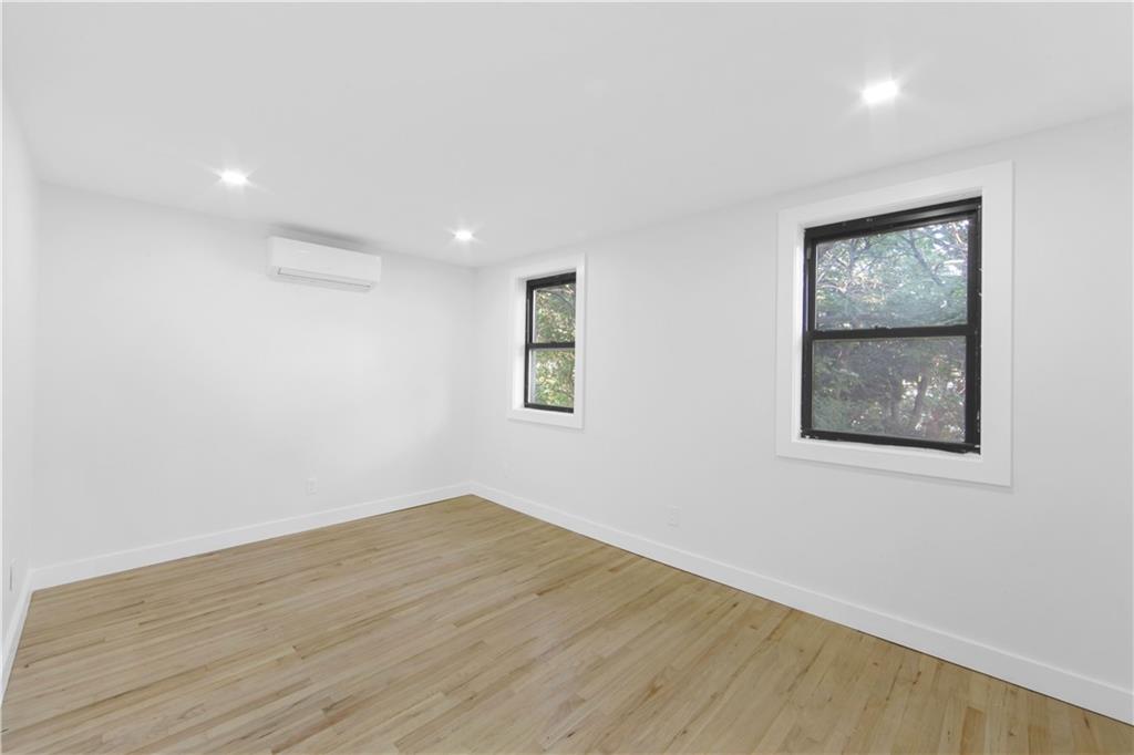 87 Adelphi Street Brooklyn, NY 11205 - Photo 27 of 35 an empty room with a window