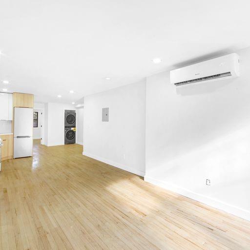 87 Adelphi Street Brooklyn, NY 11205 - Photo 3 of 35 a view of empty room with wooden floor