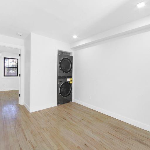 87 Adelphi Street Brooklyn, NY 11205 - Photo 9 of 35 a view of a storage & utility room with wooden floor