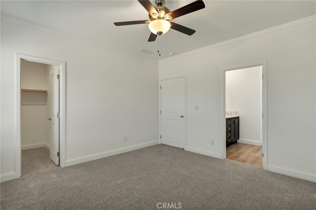 4333 Pentz Road, Unit 30 Paradise, CA 95969 - Photo 26 of 29 an empty room with closet and a chandelier fan