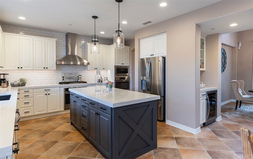 517 Via El Risco San Clemente, CA 92673 - Photo 12 of 51 a kitchen with a sink refrigerator and cabinets