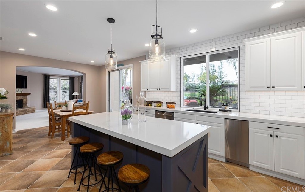 517 Via El Risco San Clemente, CA 92673 - Photo 14 of 51 a kitchen with a sink a stove a refrigerator and wooden cabinets