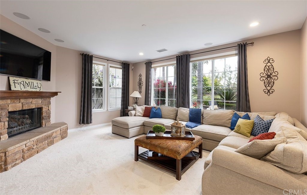517 Via El Risco San Clemente, CA 92673 - Photo 17 of 51 a living room with furniture a flat screen tv and a fireplace