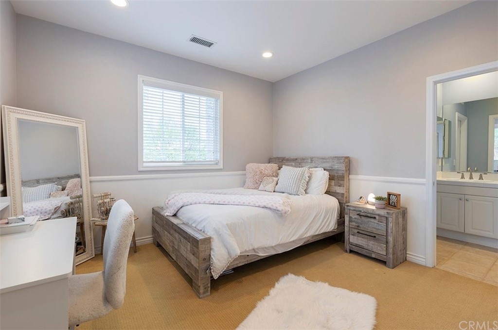 517 Via El Risco San Clemente, CA 92673 - Photo 21 of 51 a spacious bedroom with a bed and a cabinets