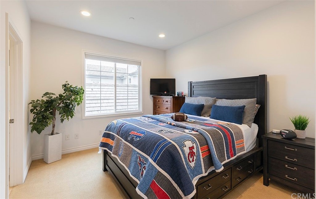 517 Via El Risco San Clemente, CA 92673 - Photo 23 of 51 a bedroom with a bed and a potted plant