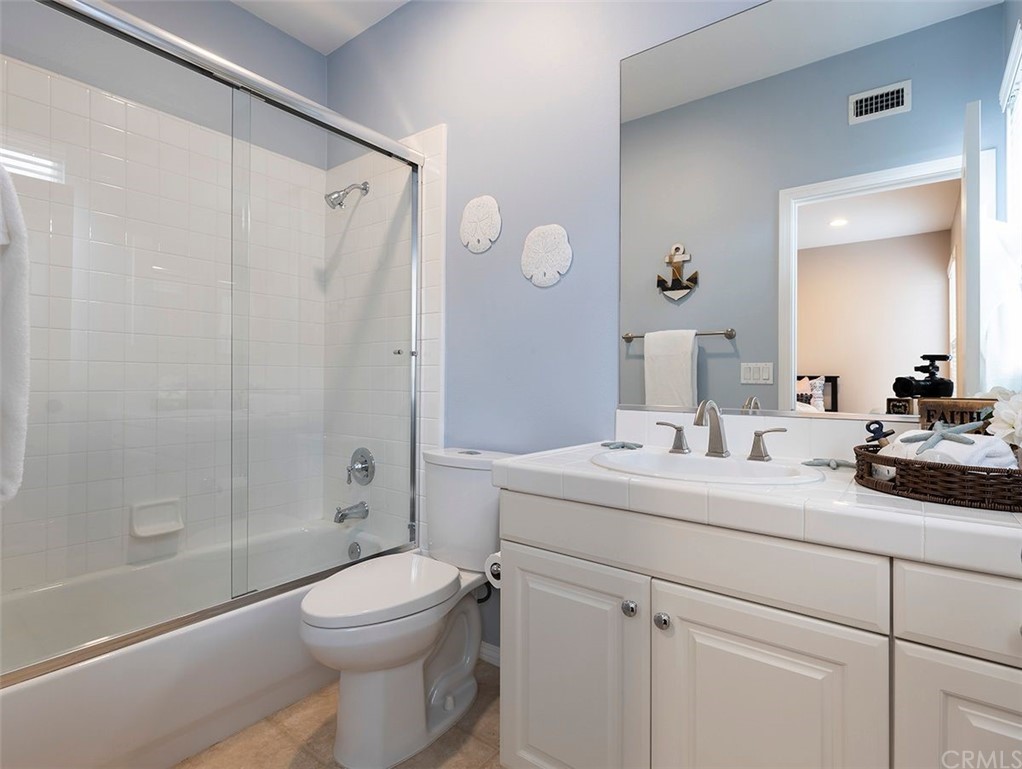 517 Via El Risco San Clemente, CA 92673 - Photo 25 of 51 a bathroom with a sink a toilet and shower