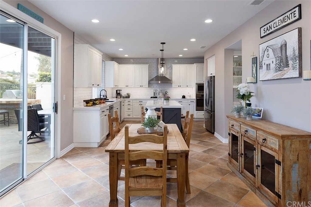 517 Via El Risco San Clemente, CA 92673 - Photo 10 of 51 a view of a dining area with furniture window and wooden floor