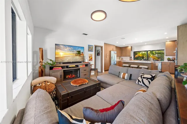 a bathroom with a double vanity sink mirror and toilet