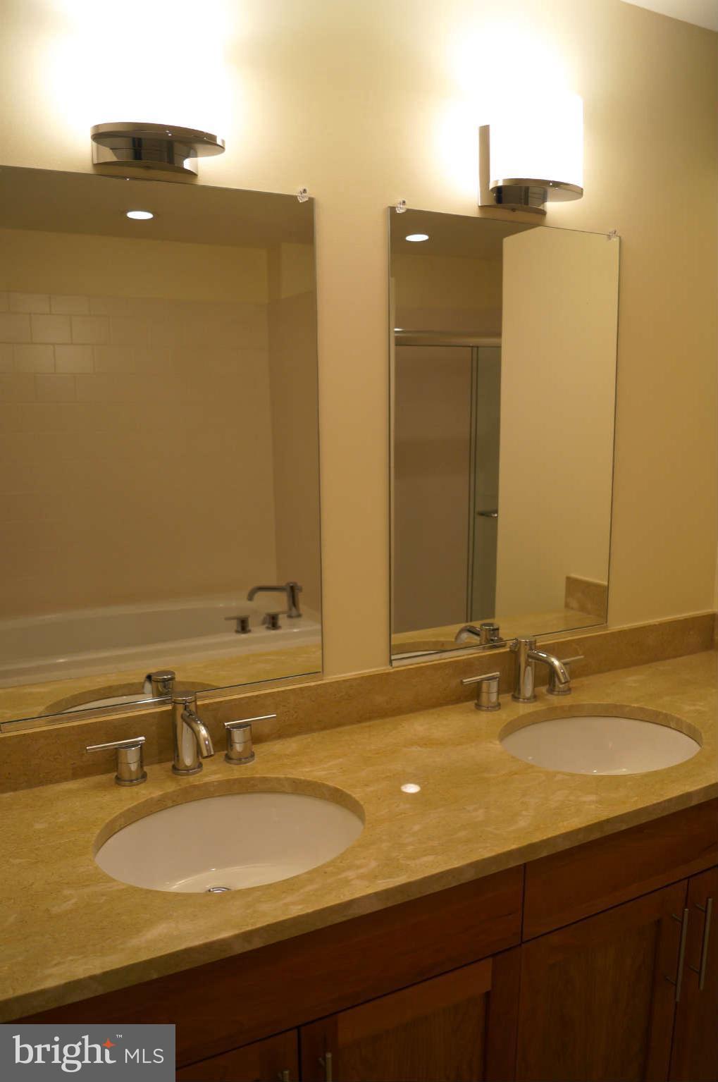 1200 Steuart Street, Unit 822 Baltimore, MD 21230 - Photo 10 of 30 a bathroom with a sink and a mirror