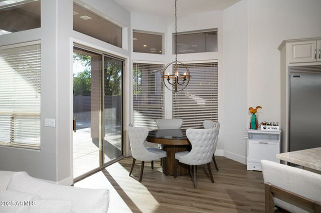 a dining room with furniture and wooden floor