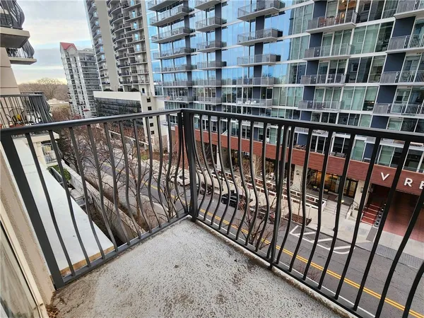 a view of balcony with wooden floor