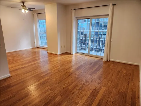 a kitchen with granite countertop a sink cabinets and stainless steel appliances