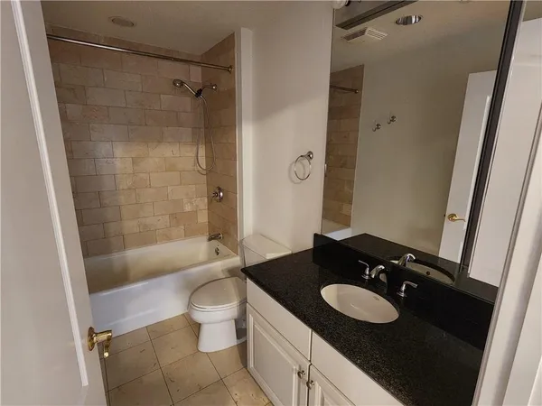 a bathroom with a shower and a bathtub
